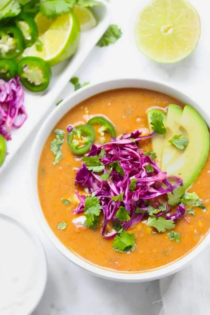 Healthy chicken tortilla soup with fresh toppings. 