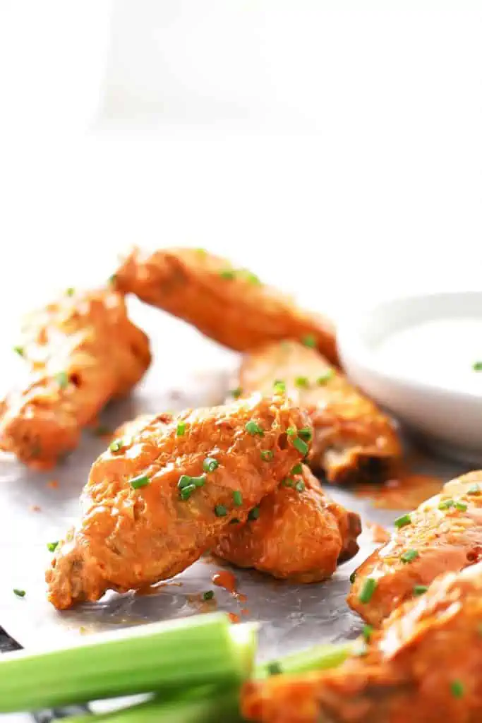 Air fryer buffalo chicken wings with celery. 