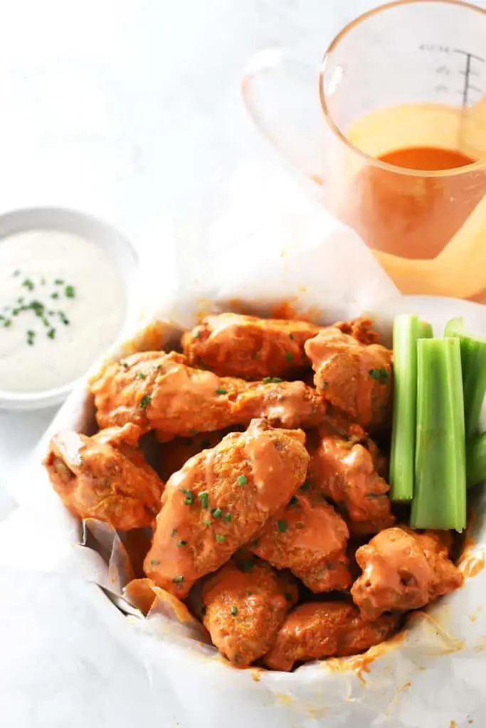 Air fryer buffalo chicken wings with celery. 