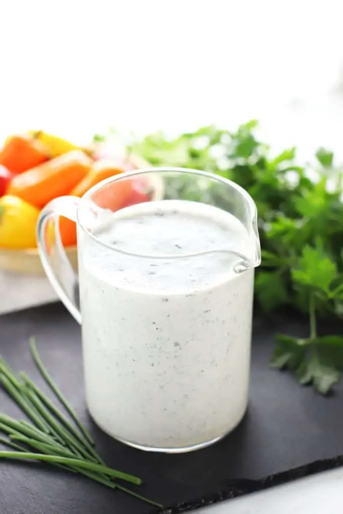 Healthy ranch dressing in glass container.