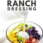 Healthy ranch dressing being poured on salad.