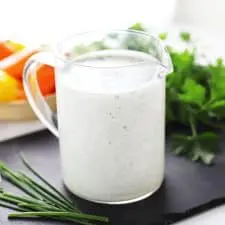 Healthy ranch dressing in glass container.