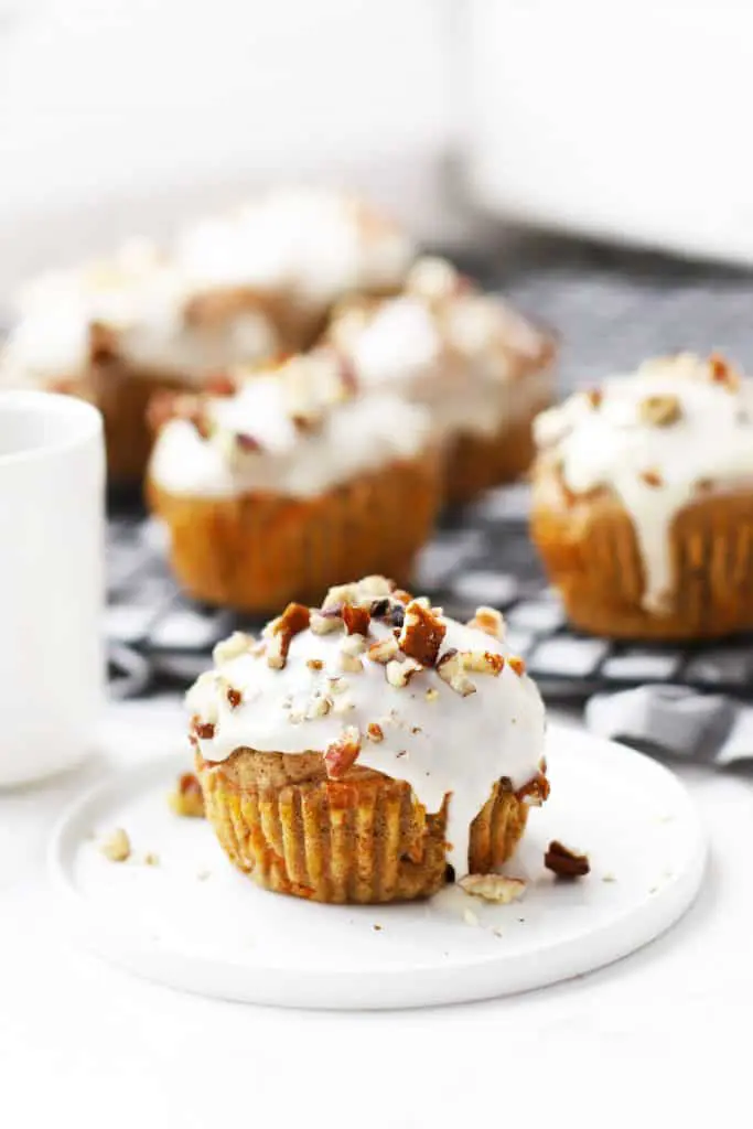 Healthy carrot cake muffins on cooling rack.