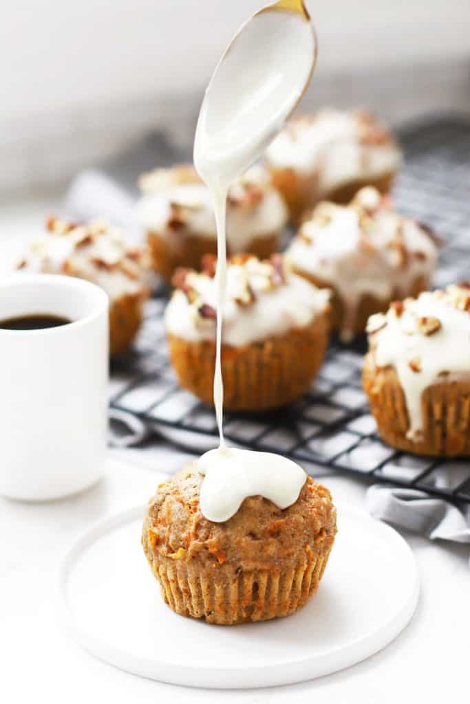 Healthy carrot cake muffins on cooling rack.
