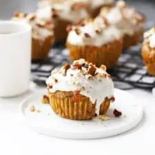 Healthy carrot cake muffins on cooling rack.