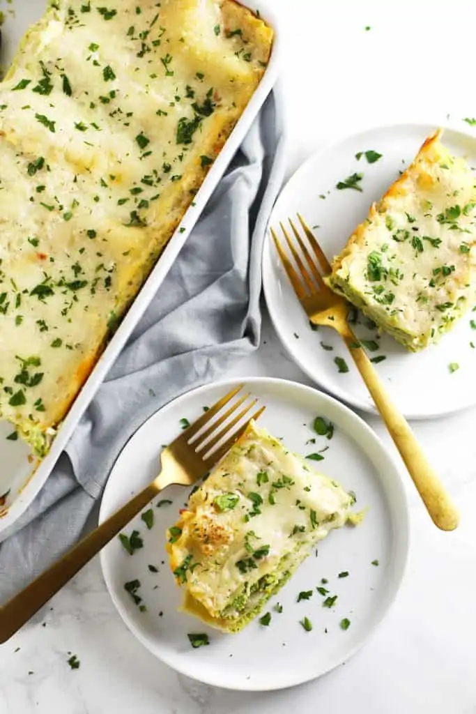 A piece of chicken lasagna on a white plate.