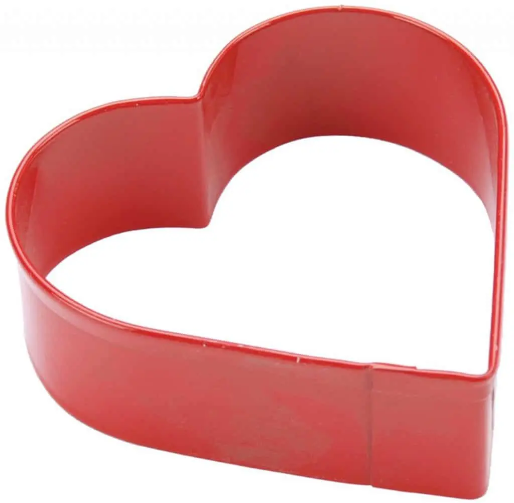 Heart cookie cutter isolated in white.