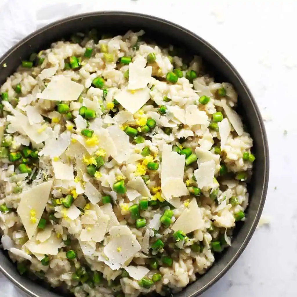 Lemon asparagus risotto in a grey bowl.