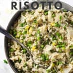 Lemon asparagus risotto in a grey bowl with a spoon.