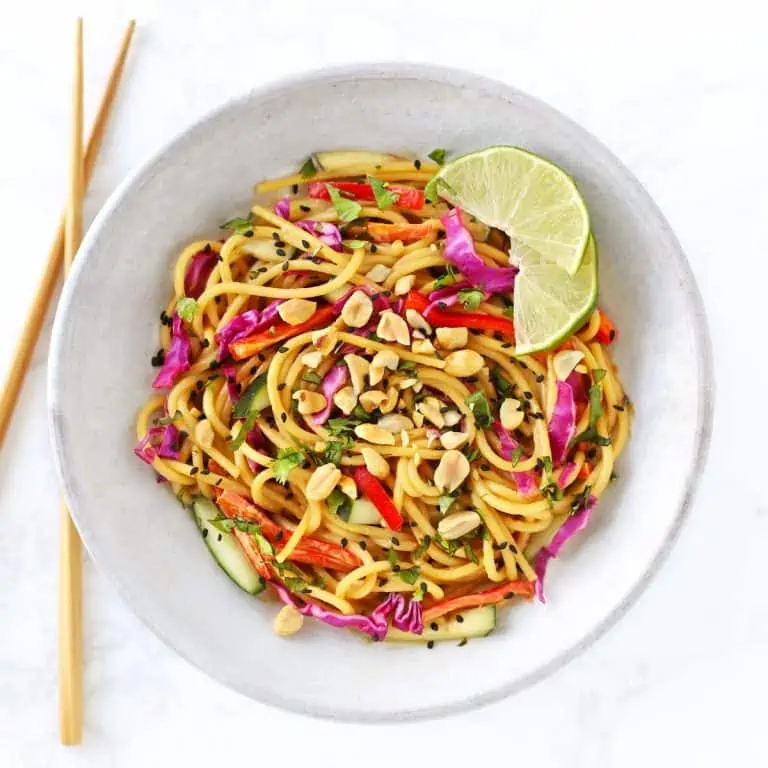 Thai noodle salad in grey bowl with chopsticks.