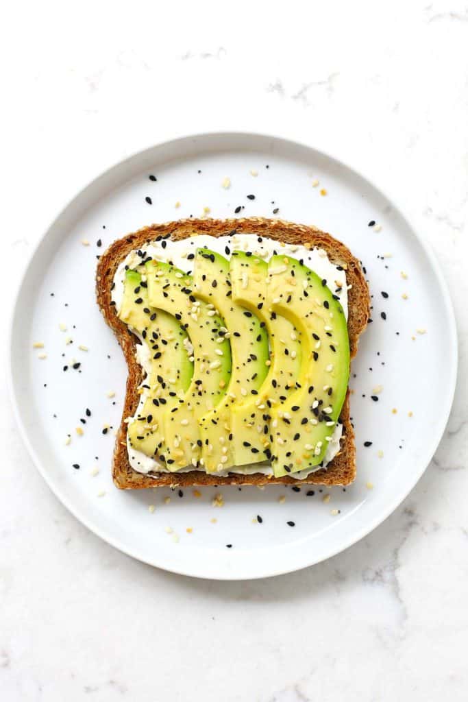 Everything bagel avocado toast in a white plate. 