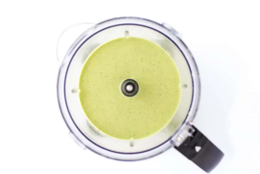 Lemon basil cashew sauce in food processor.