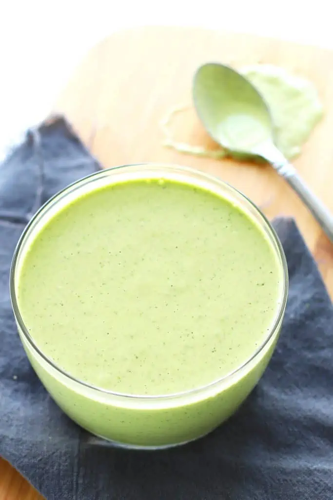 Lemon basil cashew sauce in glass bowl.