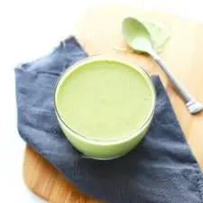 Lemon basil cashew sauce in glass bowl.