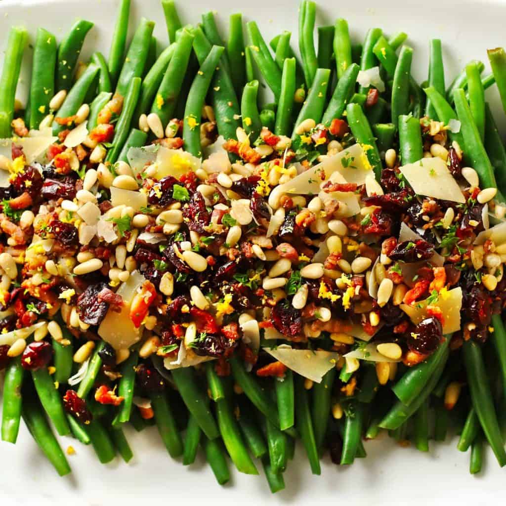 Lemon garlic green beans with crispy pancetta and loaded toppings.