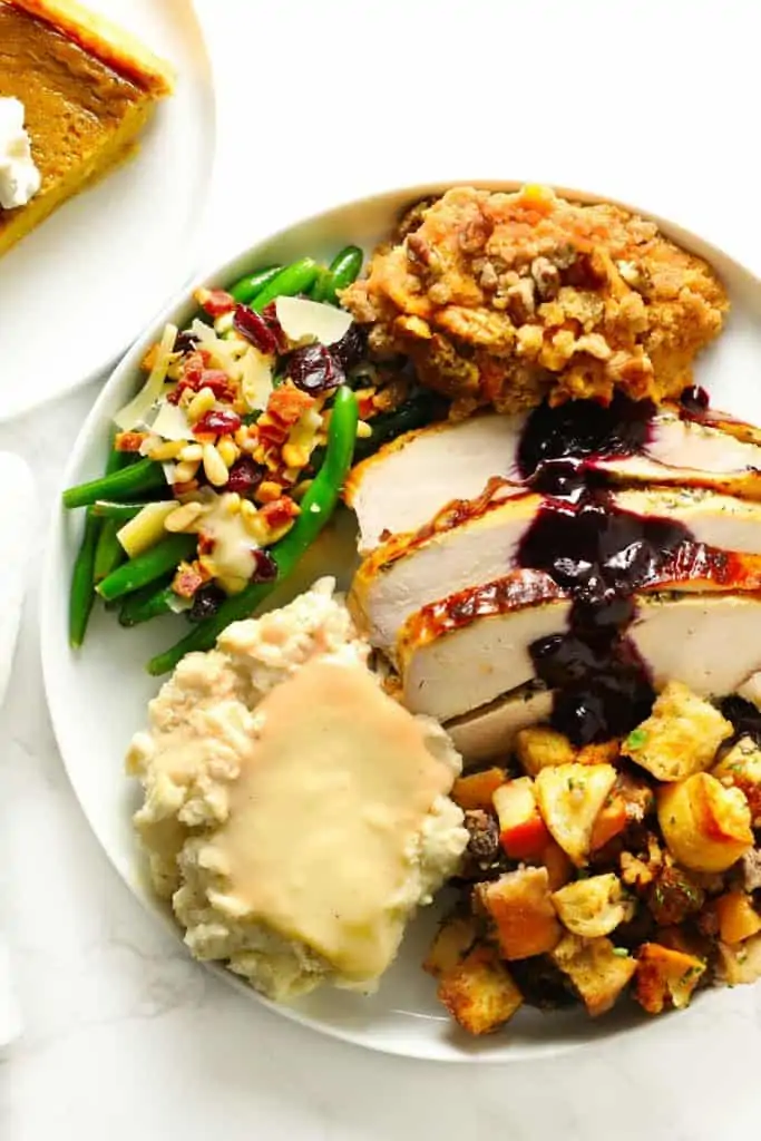Make-ahead Thanksgiving meal on white plate. 