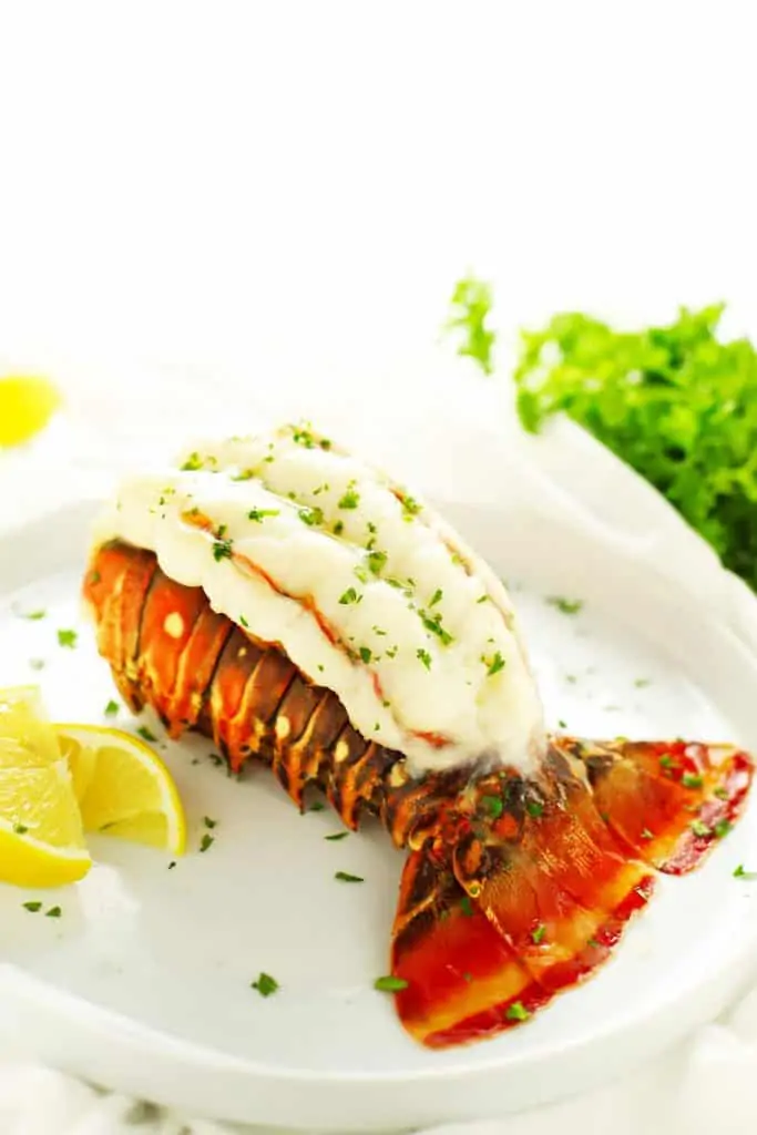 Butterflied baked lobster tail with lemon. 