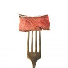 Piece of sous vide steak on a fork.