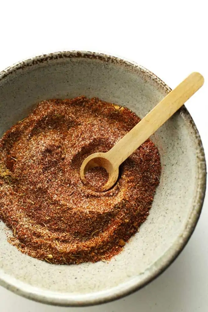 Steak seasoning in bowl with spoon.