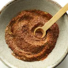 Steak seasoning in bowl with spoon.