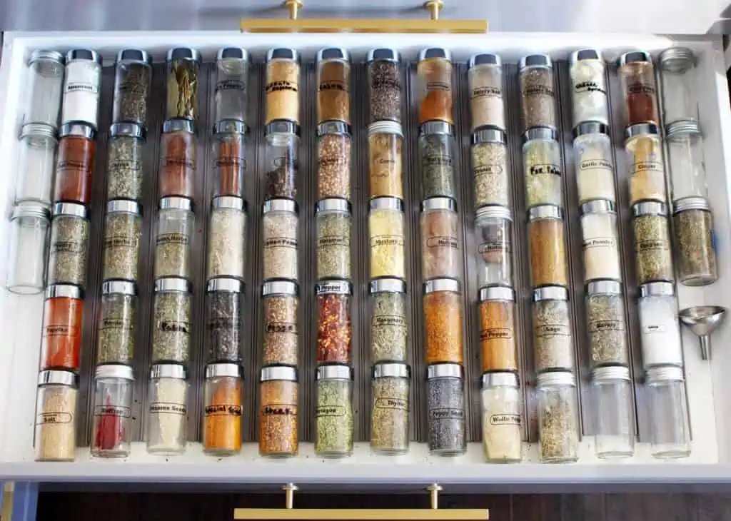 Spice jars in a drawer. 