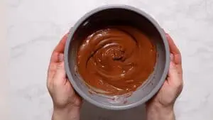 Melted chocolate in grey bowl.