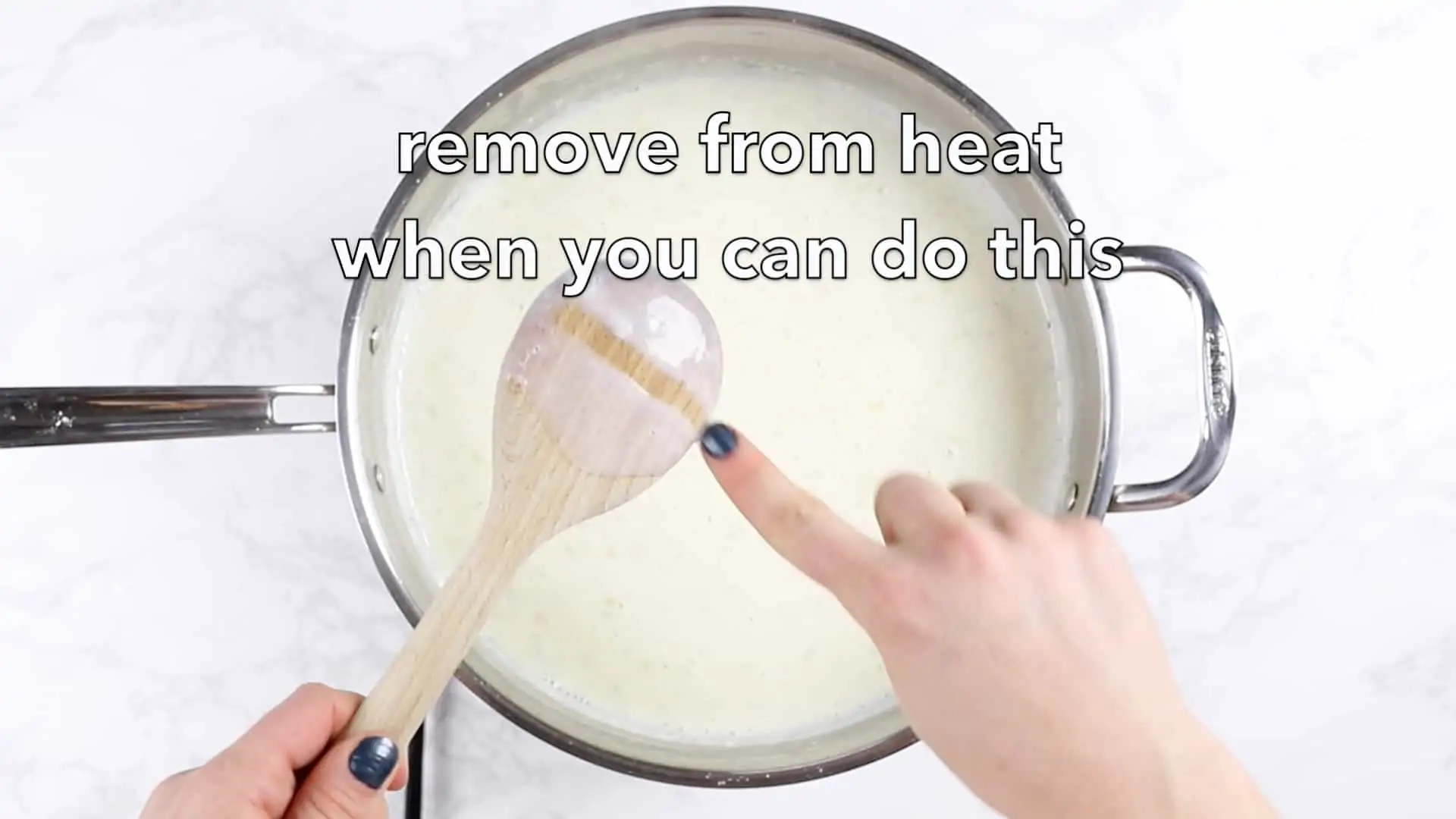 Wooden spoon making sauce. 