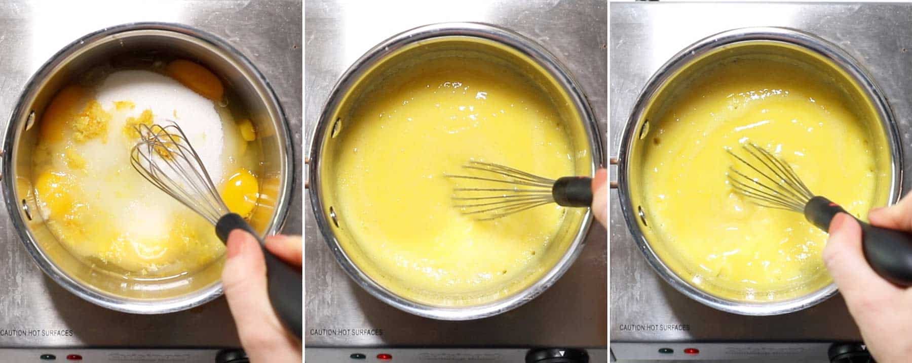 A whisk in a pot with lemon curd cooking.