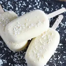 Three popsicles on grey serving platter.