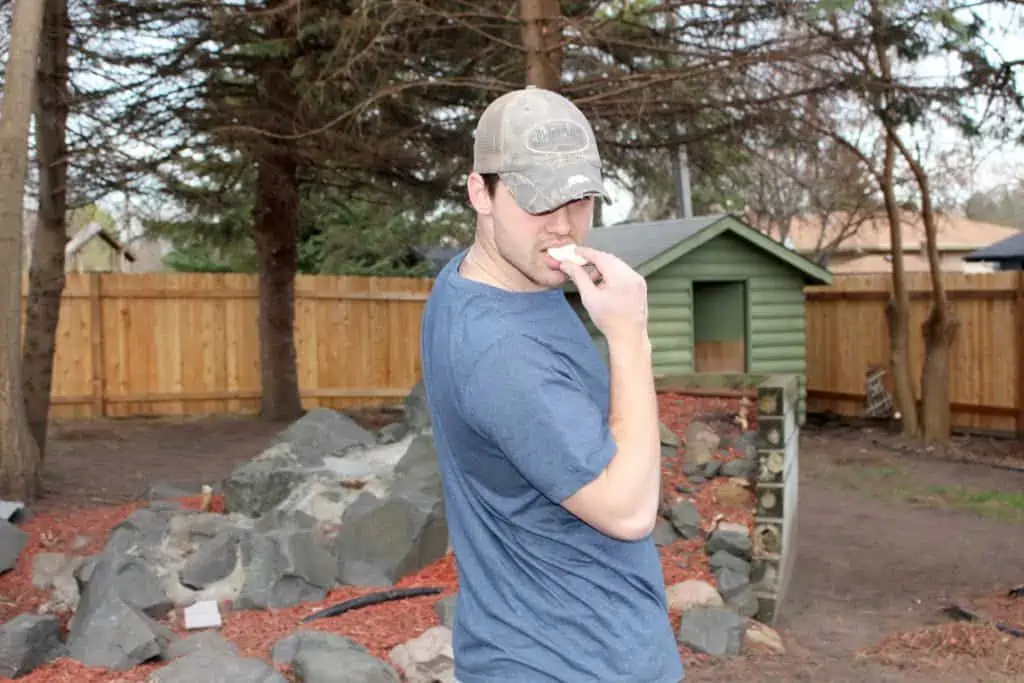 Man eating hard boiled egg.