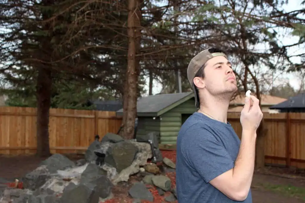 Man holding hard boiled egg.