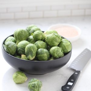 Brussels sprouts in grey bowl.