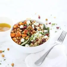 Sweet potato and quinoa salad in white bowl.