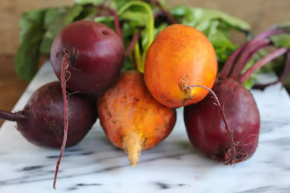 Beets on marble cutting board.